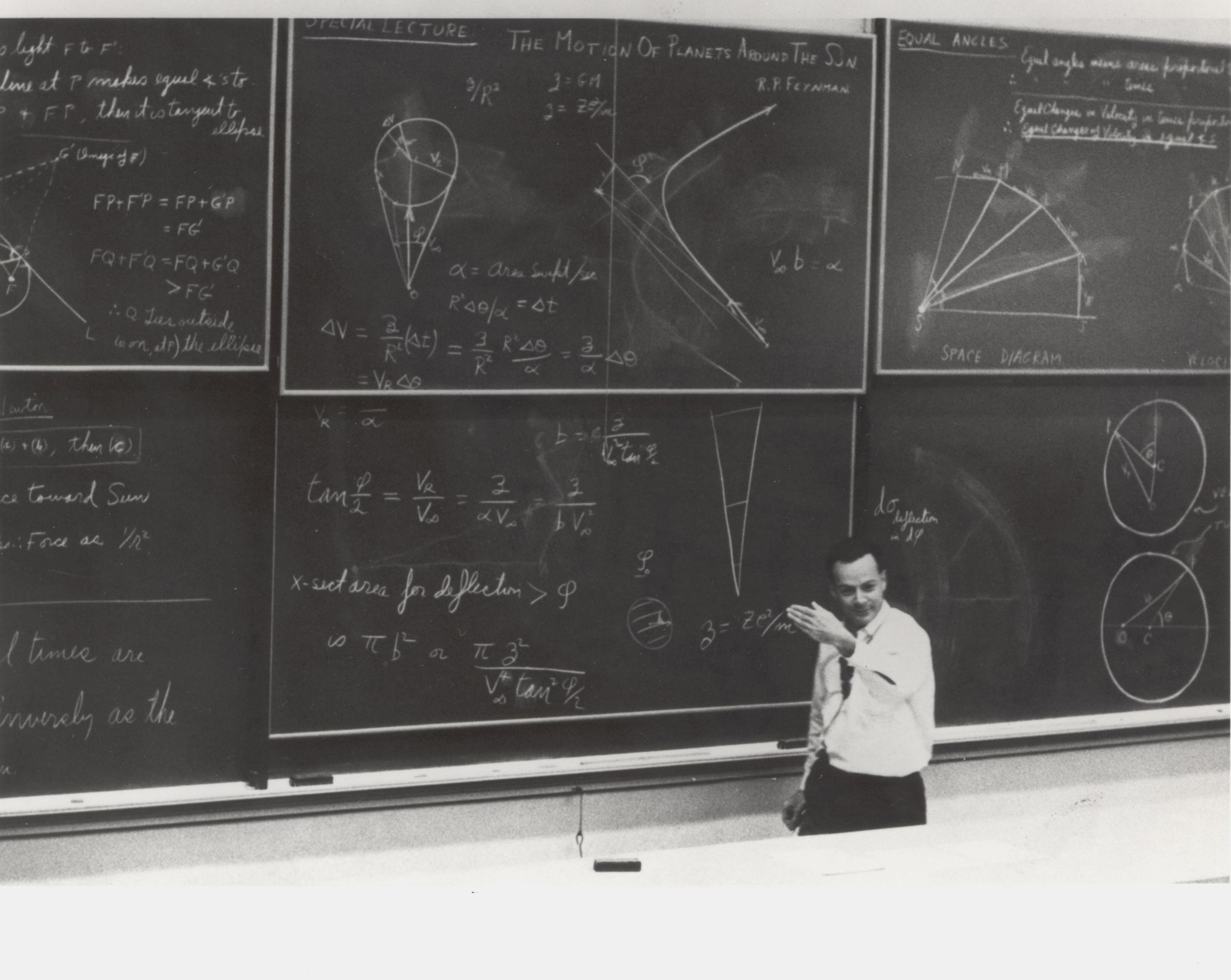 A photograph of Richard Feynman teaching